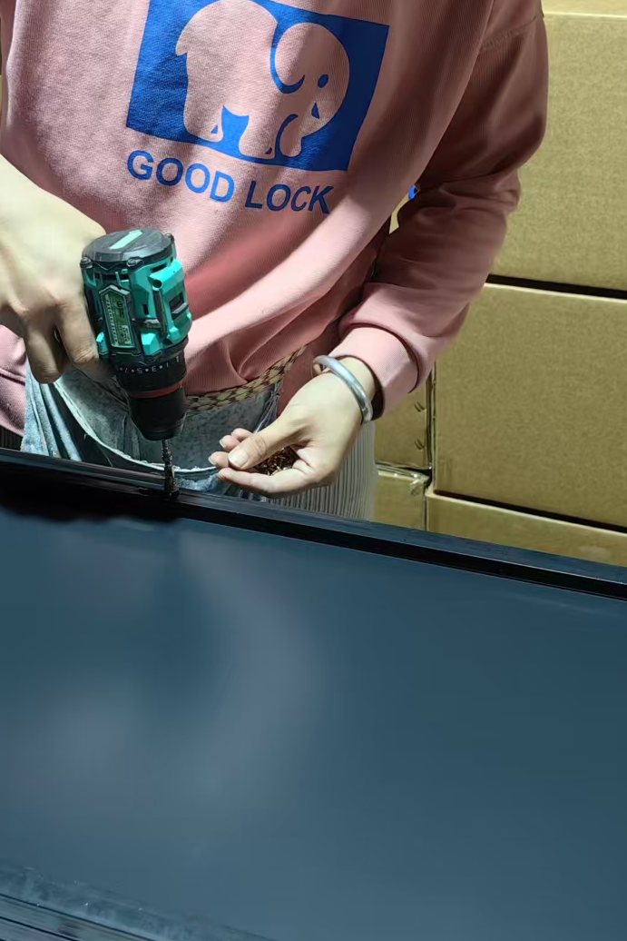 Folding stand bracket being fixed to the back of a mirror frame