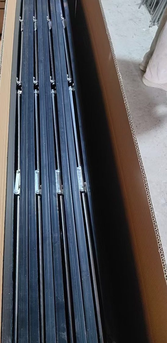 Full-length mirrors stacked inside an open shipping carton