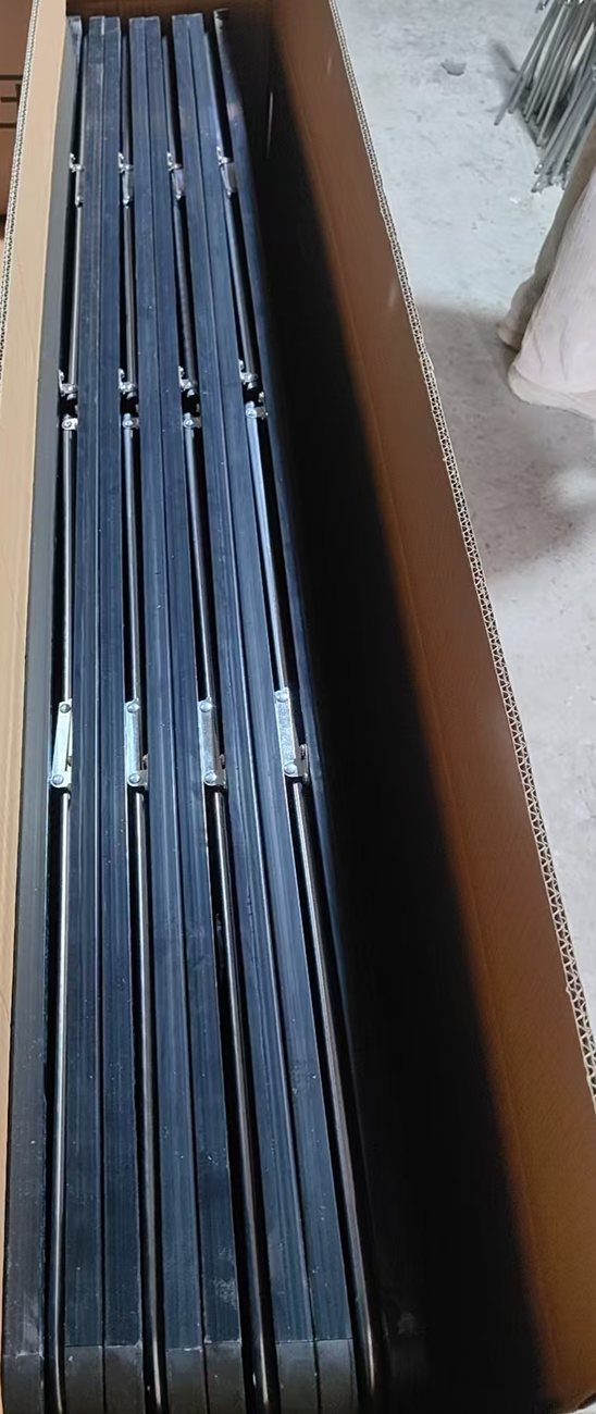Full-length mirrors stacked inside an open shipping carton