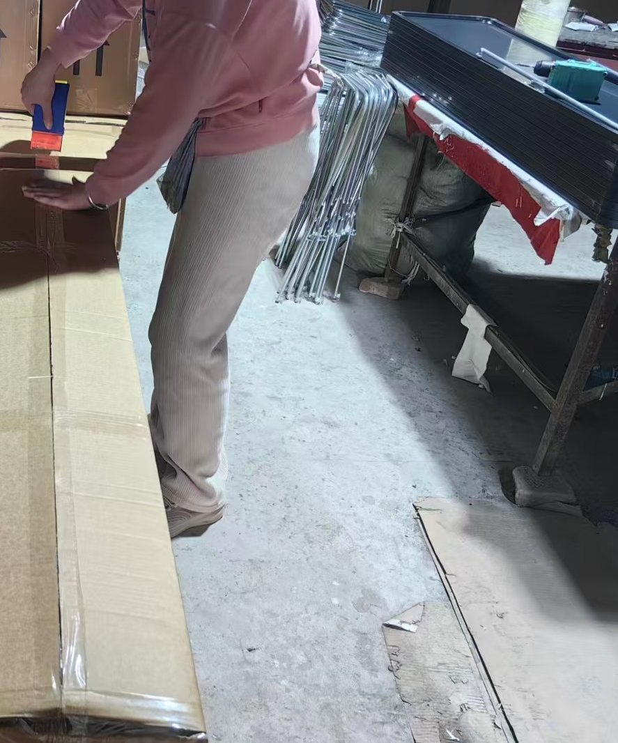 Cartons being sealed at the packing station