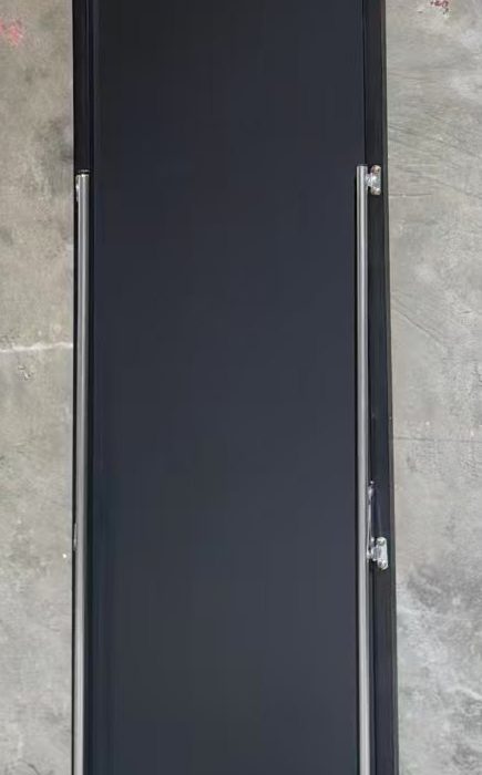 Rear strut and hinge on the back of a full-length mirror
