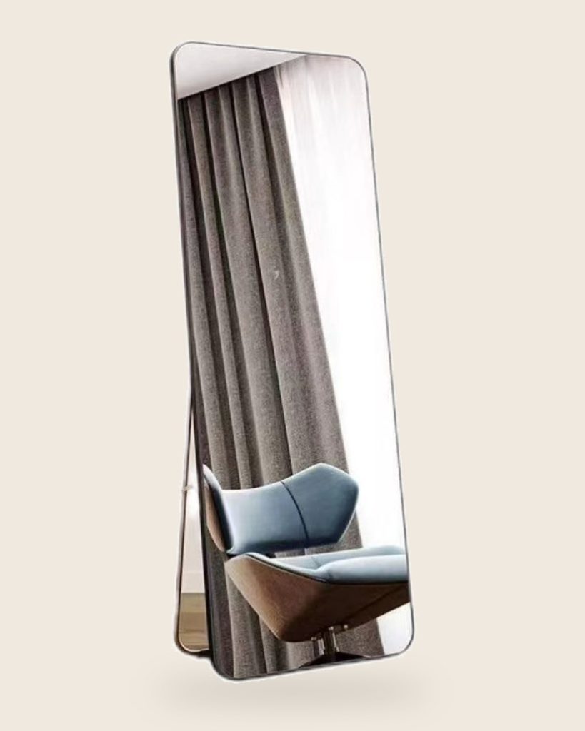 Freestanding full-length mirror with a slim black frame and folding rear easel